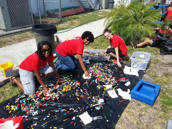 Keller Williams Realty associates washing legos for the updated room at the Boys and Girls Club of North Lauderdale