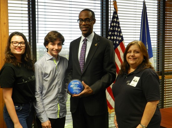 EF High School Exchange Year Regional Coordinator Laura Barry (far right), accompanied by EF exchange students Anna-Lea Fischer from Germany and Paolo Bellentani from Italy, presenting the 2013/14 Global Education Excellence Award to Superintendent Robert W. Runcie for the District’s support of international exchange.