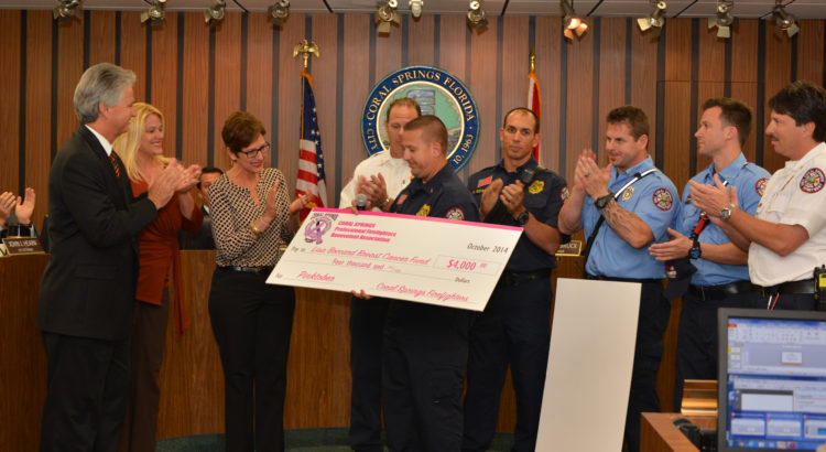 Coral Springs Fire Department Presents Checks for National Breast Cancer Awareness Month