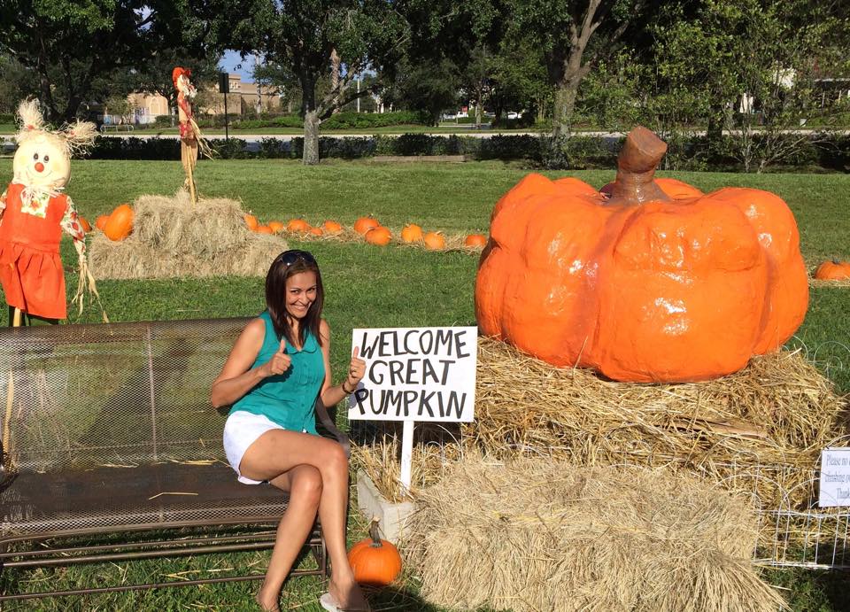 Chris Darling at the "selfie statin" next to her Great Pumpkin creation