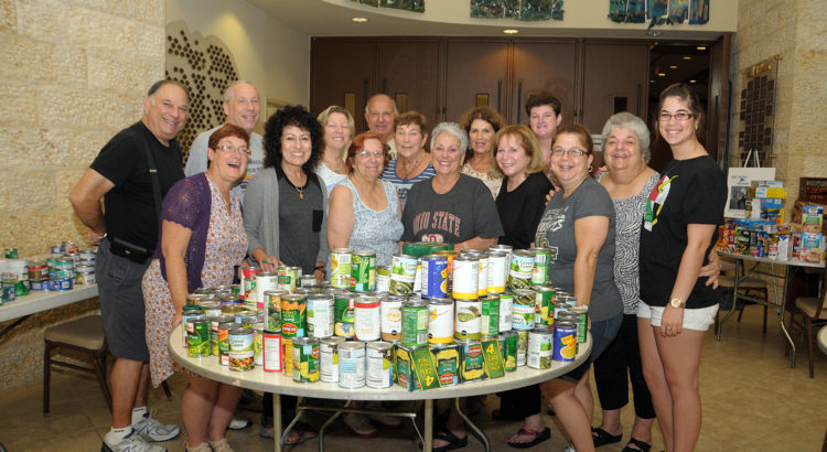 Temple Volunteers Sort Food Donations to Help Needy Families