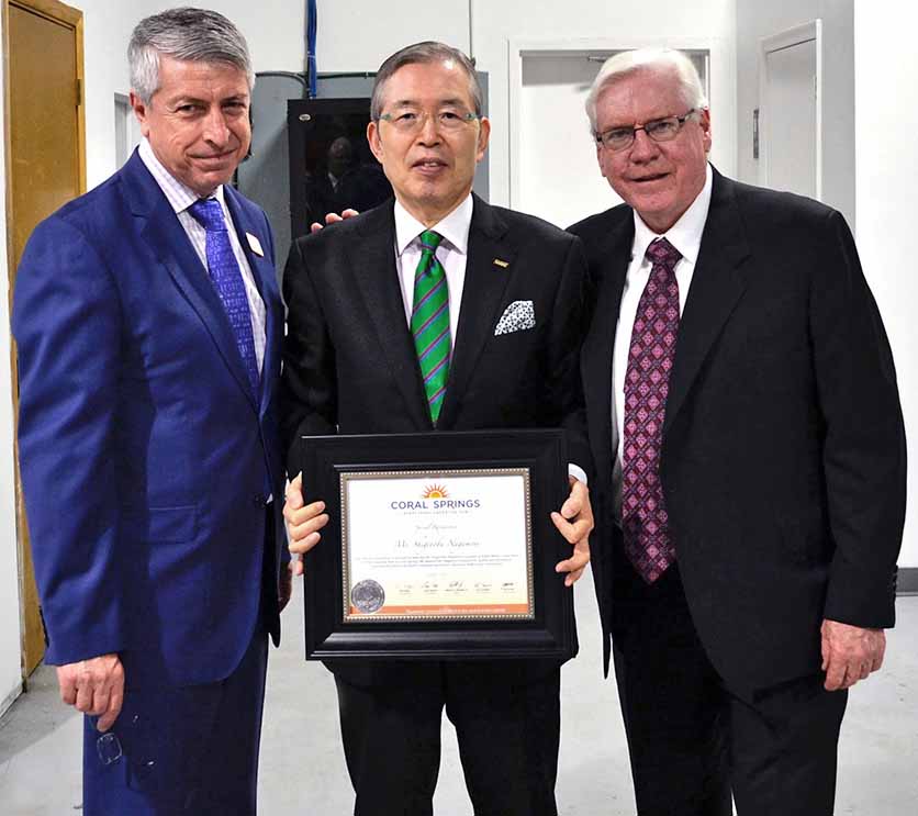 City Manager Erdal Donmez, Mr. Shigenobu Nagamori, Founder and CEO of Nidec Motor Corporation, and Mayor Skip Campbell welcomes Nidec to Coral Springs