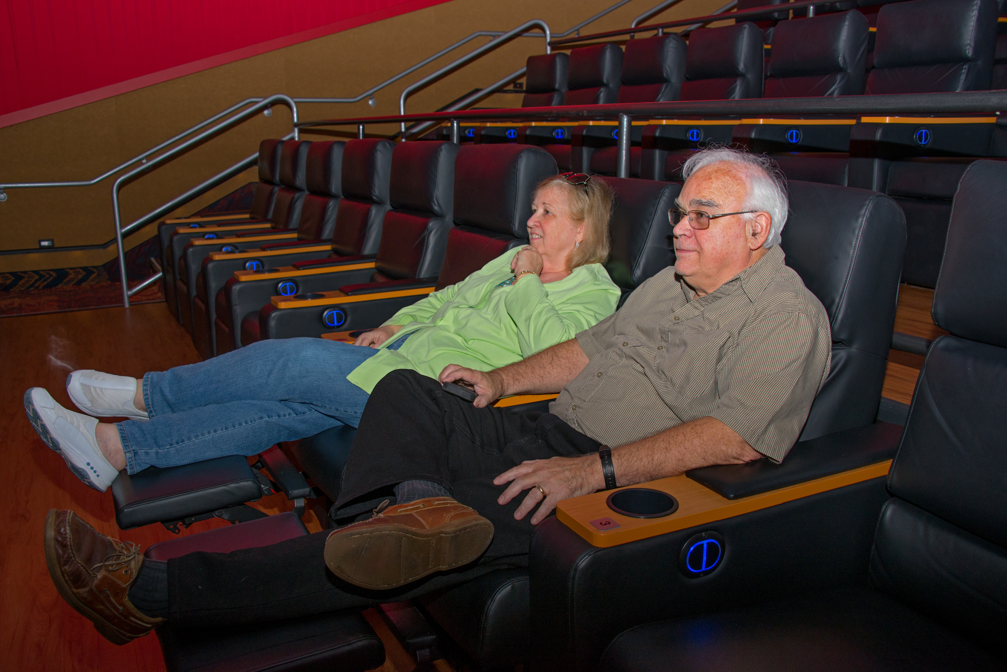 Coral Springs, FL residents Sharon and Ward Bennett enjoying the new leather recliners before a matinee at the Regal Magnolia Theater. - Photos by Sharon Aron Baron