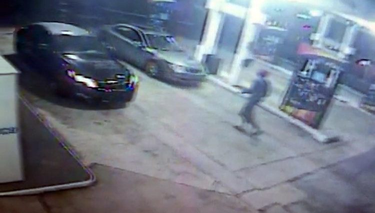 Surveillance from the Sunoco shows the suspect casing the car.