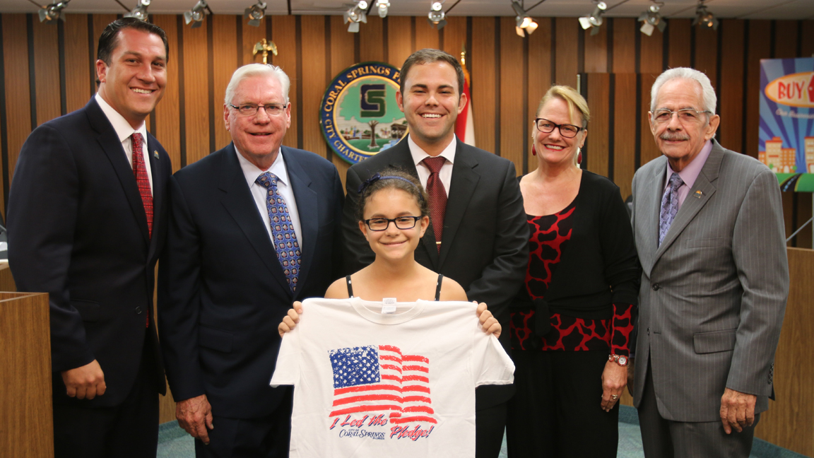 Commissioner Larry Vignola, Mayor Skip Campbell, Vice Mayor Dan Daley and Commissioners Joy Carter and Lou Cimaglia with a student. 