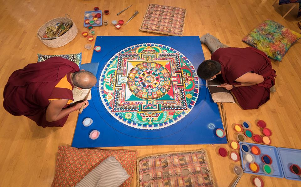 Tibetan Monks constructing the Sand Mandala in Coral Springs in 2016. Photo by Adam Baron.