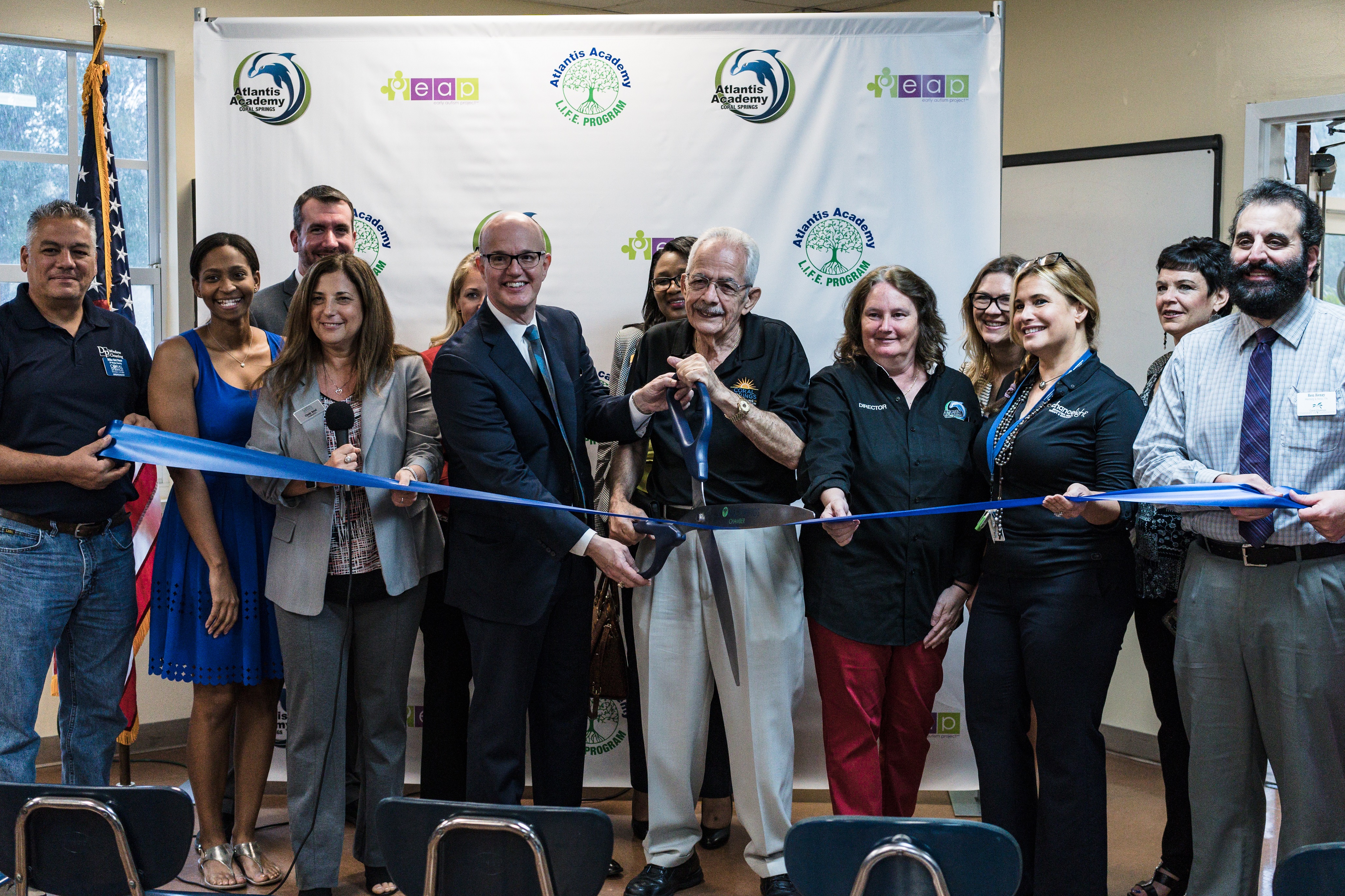 Ribbon cutting for the Atlantis Academy Early Autism Project. 