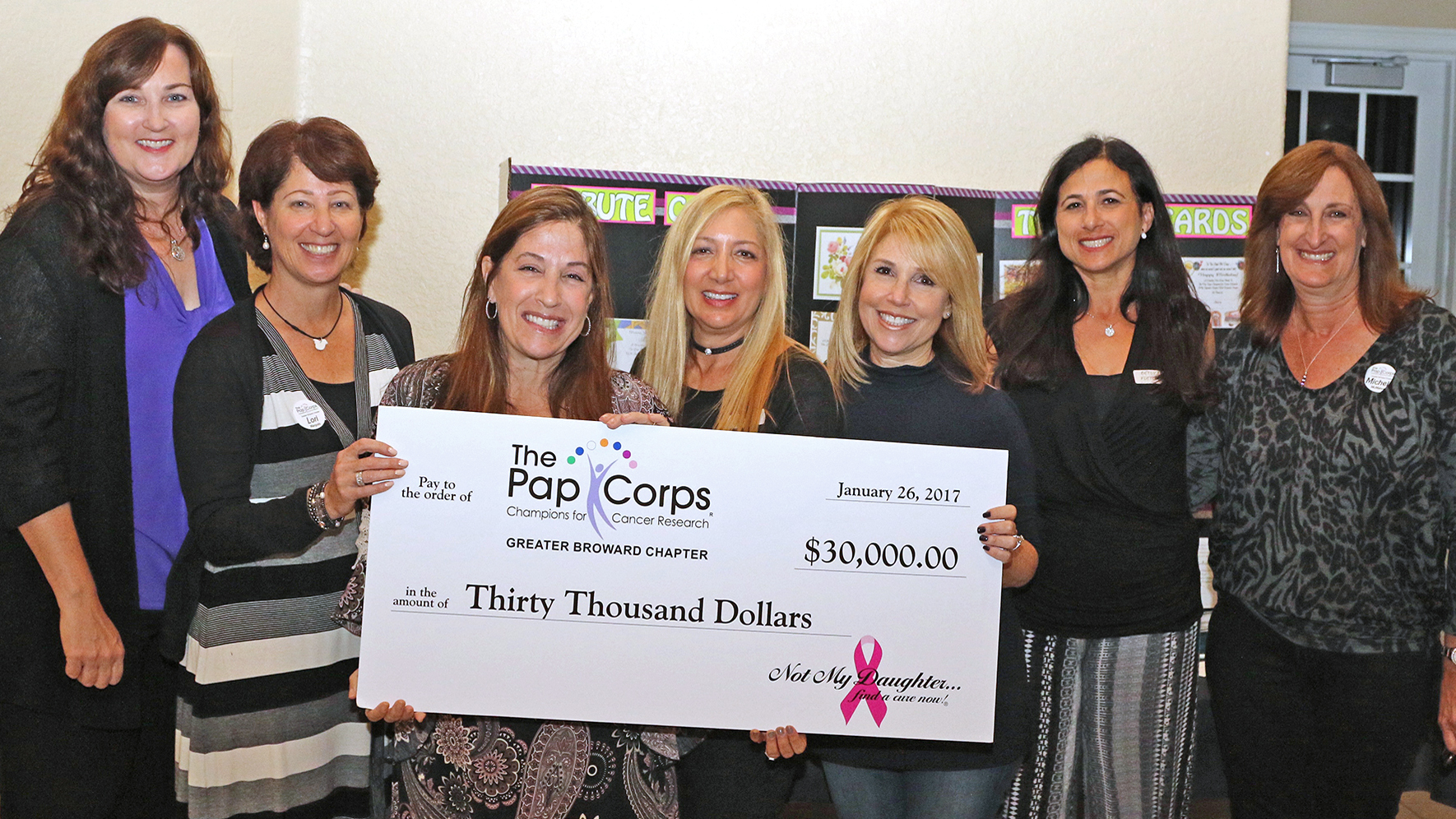 Check presentation.  Left to Right: Parkland Mayor Christine Hunschofsky; Lori Margolis, President Greater Broward Chapter, The Pap Corps.; Jody Sternfield, Debi Weisman, Denyse Hostig, Betsy Fletcher from Not My Daughter; and Michele McMahon, Executive V.P., Greater Broward Chapter, The Pap Corps.