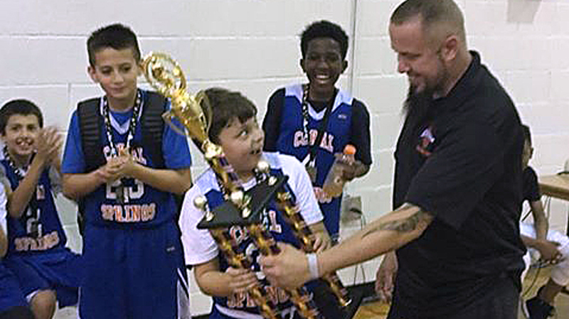 After Father's Death, Basketball Coach Awards Son with Team's First Place Trophy
