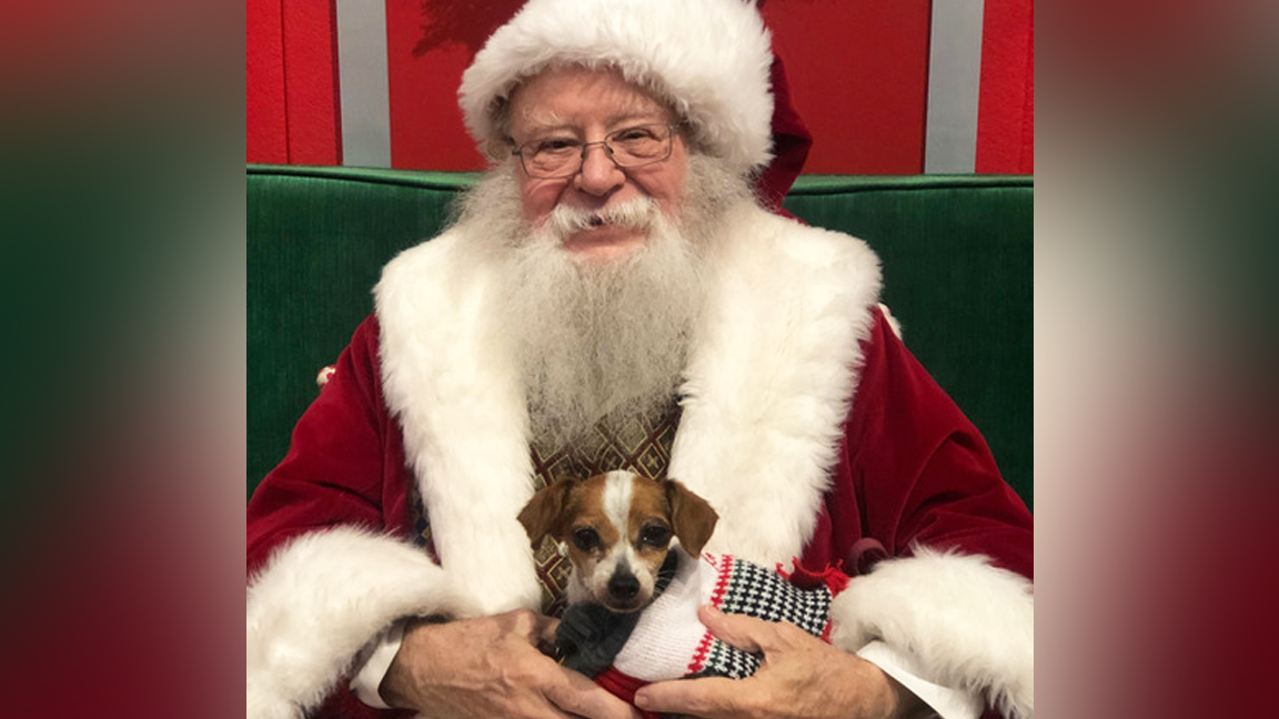 Santa and his furry friend at Coral Square Mall in Coral Springs.