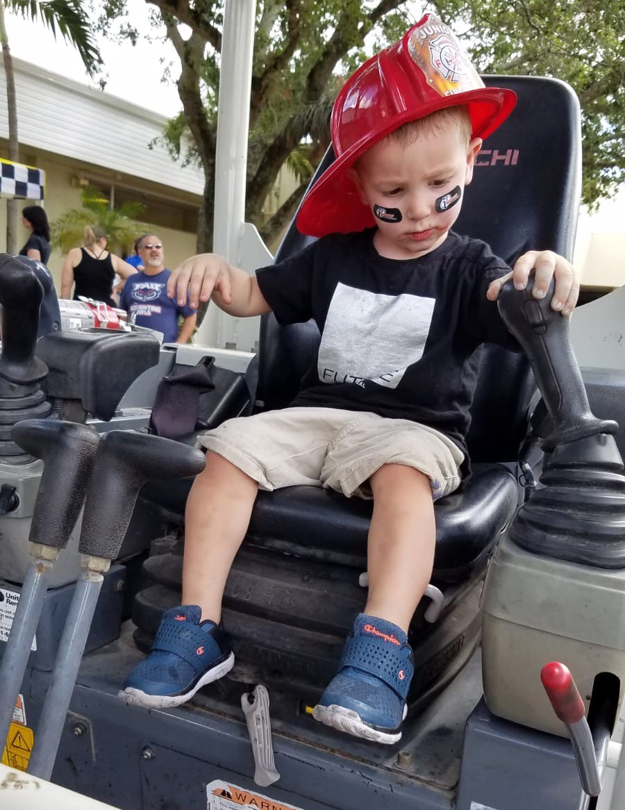 Joshua Bernstein, 3, takes a turn on one of the many trucks at the 2019 event.