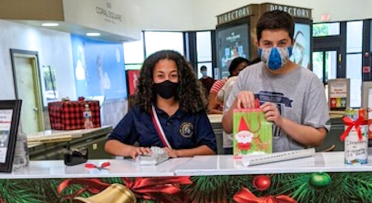 J.P. Taravella Band Members Work Gift-wrapping Booth as Their Sole 2020 Fundraiser