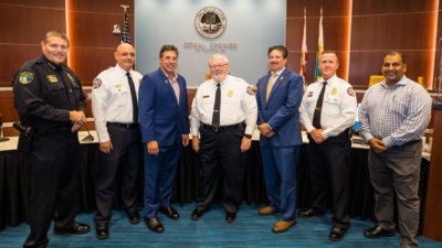 Chief Clyde Parry, Division Chief Chris Bator, Mayor Scott Brook, Rev. Ronald Perkins,  City Manager Frank Babinec, Fire Chief Michael McNally, and Fire Department Clinician Sean Khan. {City of Coral Springs}