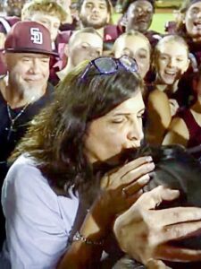 Marjory Stoneman Douglas Football Dominates Pig Bowl: Coral Springs Principal Kisses the Pig