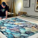 Artist Scott Schneider works on one of his photos called Jigsaw Puzzle which will be on exhibit at the Coral Springs Museum of Art. (Photo courtesy of Toxic Nature Studios)