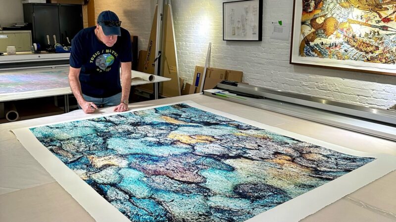 Artist Scott Schneider works on one of his photos called Jigsaw Puzzle which will be on exhibit at the Coral Springs Museum of Art. (Photo courtesy of Toxic Nature Studios)