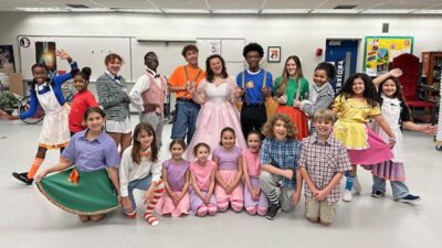 Austin Blakely (Lion), Briana De Los Santos (Dorothy), Marco Medina (Scarecrow), Benjamin Arteaga (Tinman) at a showing of Wicked at Regal Movie Theatre.