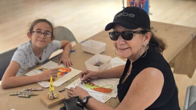 Isabel Valverrami and her granddaughter Elena Jaeger participated in a graffiti art project at the Family Day