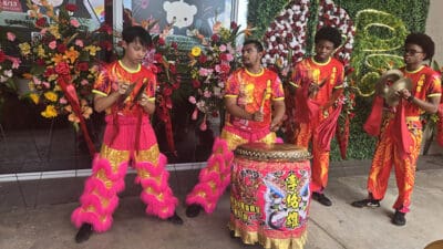 Drummers perform before the KPOT ribbon cutting on August 13